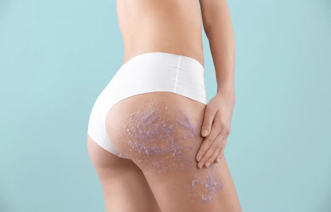 Mechanical skin exfoliant spread out over the butt of a person