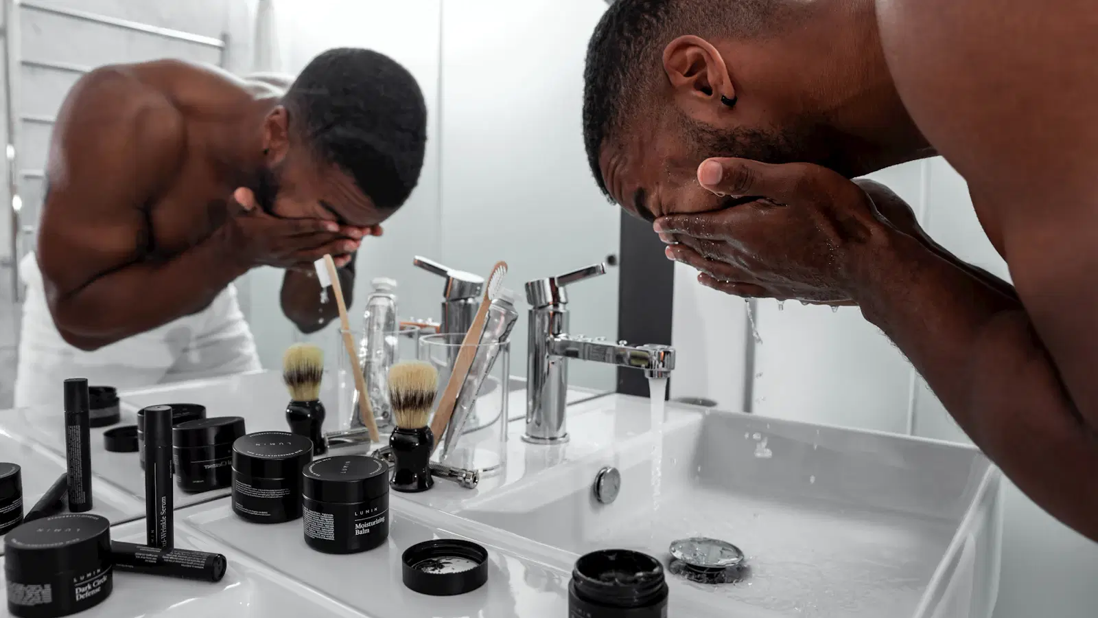 Flat-lay of the best anti-wrinkle moisturisers for men including retinol, peptide, and SPF picks on a clean bathroom shelf