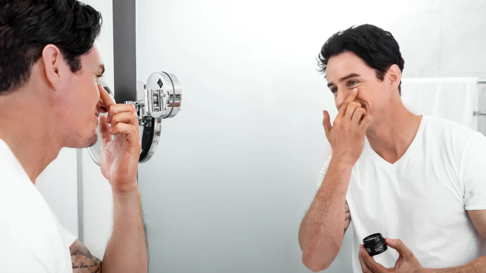 Men's anti-wrinkle routine layout — vitamin C serum, ceramide moisturizer, retinaldehyde cream, and peptide cream arranged in application order