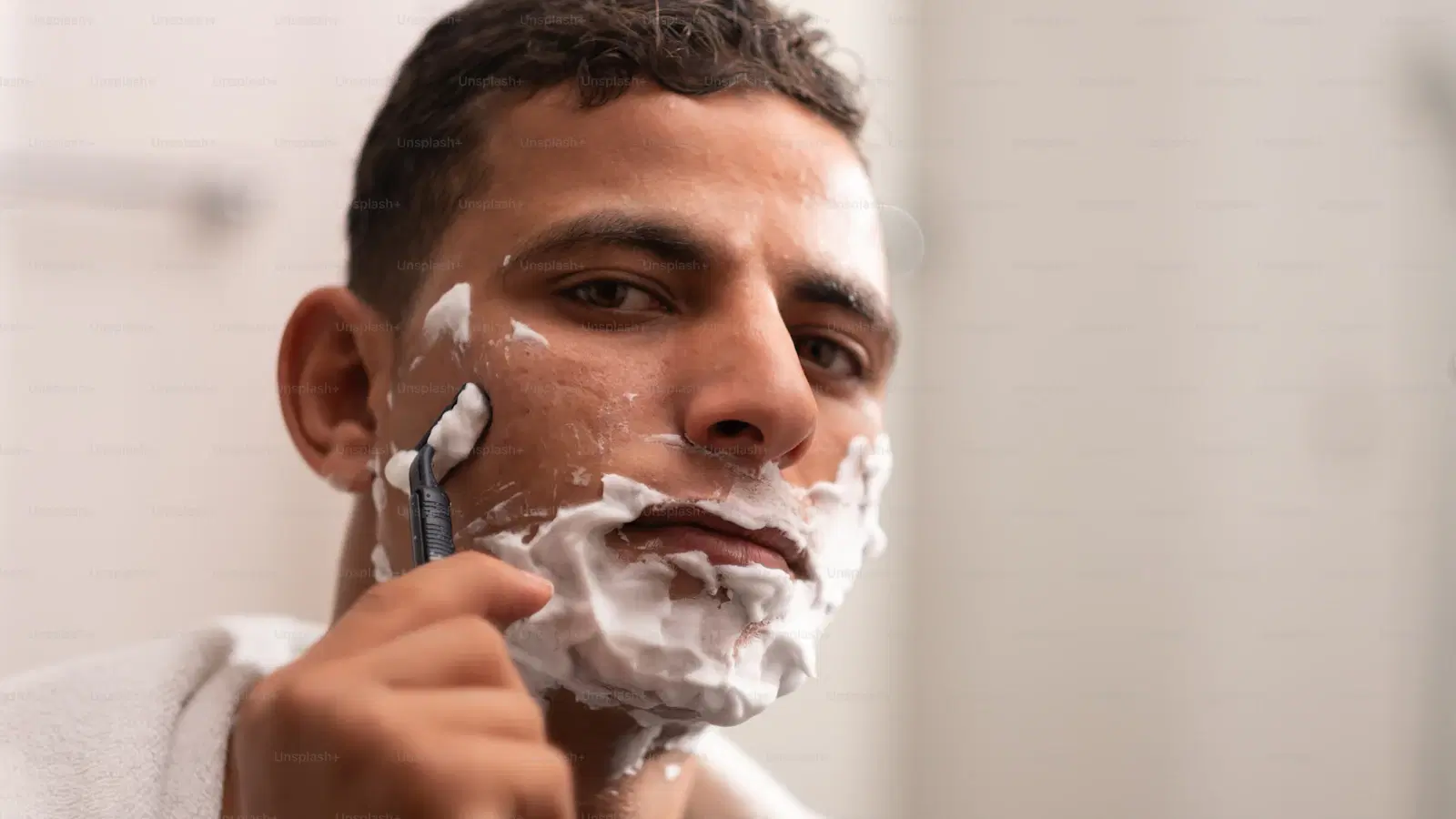 Close-up of a pubic shave cream ingredient label showing glycerin as the second ingredient and no fragrance listed — how to read shave-cream labels