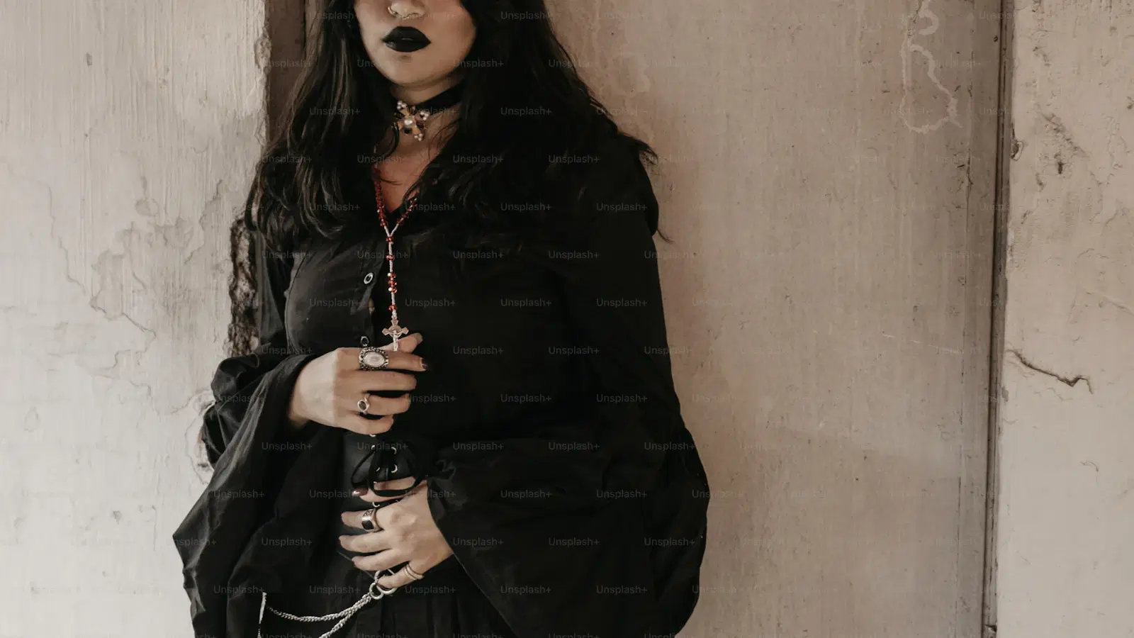 Gothic femboy outfit example — black cropped hoodie, plaid pleated skirt, ripped fishnets, and chunky platform boots