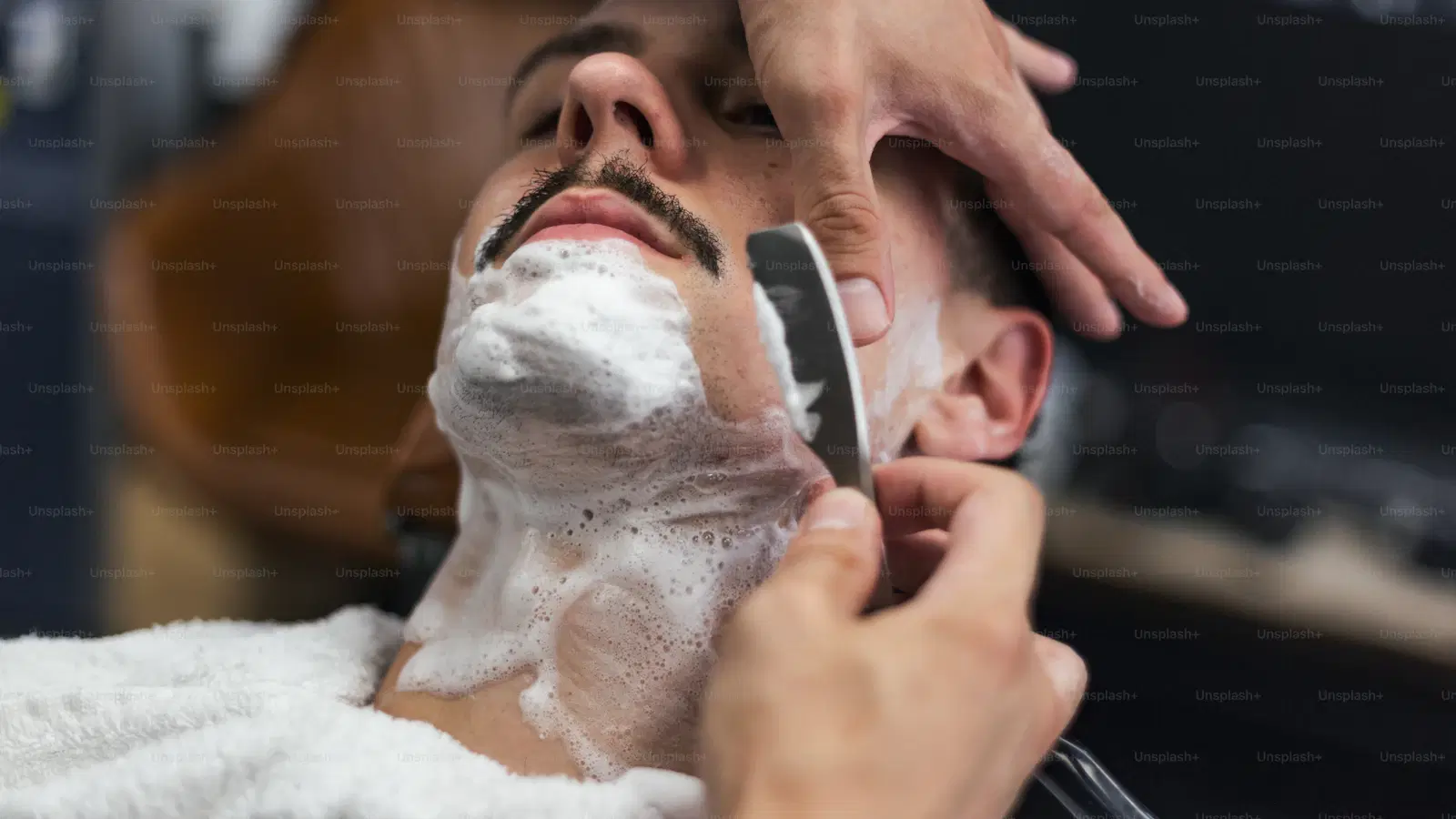 Cross-section diagram showing hair below and above the skin, with the 6 mm of exposed shaft needed for wax to grip and lift the follicle from the root