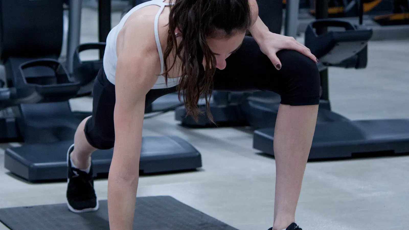 Femboy body-shaping routine — glute bridge demonstration with resistance band above the knees for waist and hip development