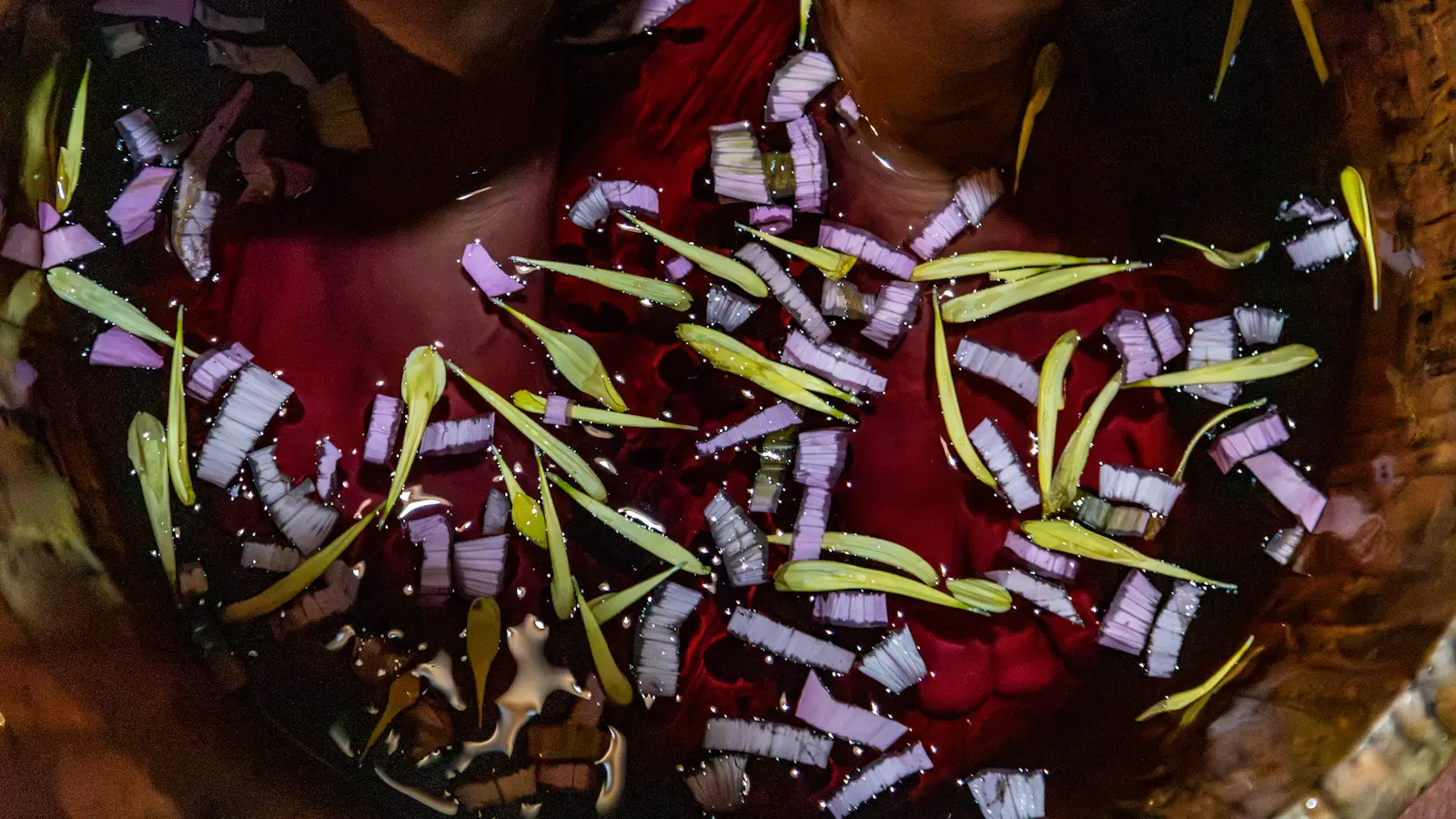 Man receiving professional laser hair removal on the chest with a cooling-tip handpiece — the session most likely to deliver long-term permanent hair reduction