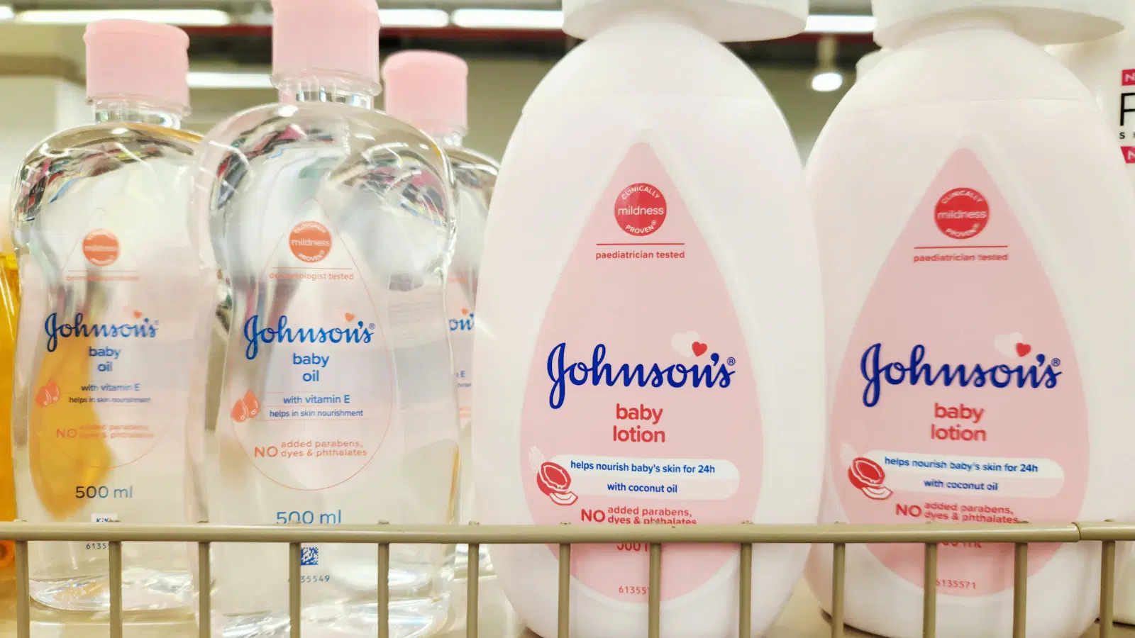 Applying a pre-shave body oil to the inner thigh before shaving to soften the hair and reduce ingrown hair risk