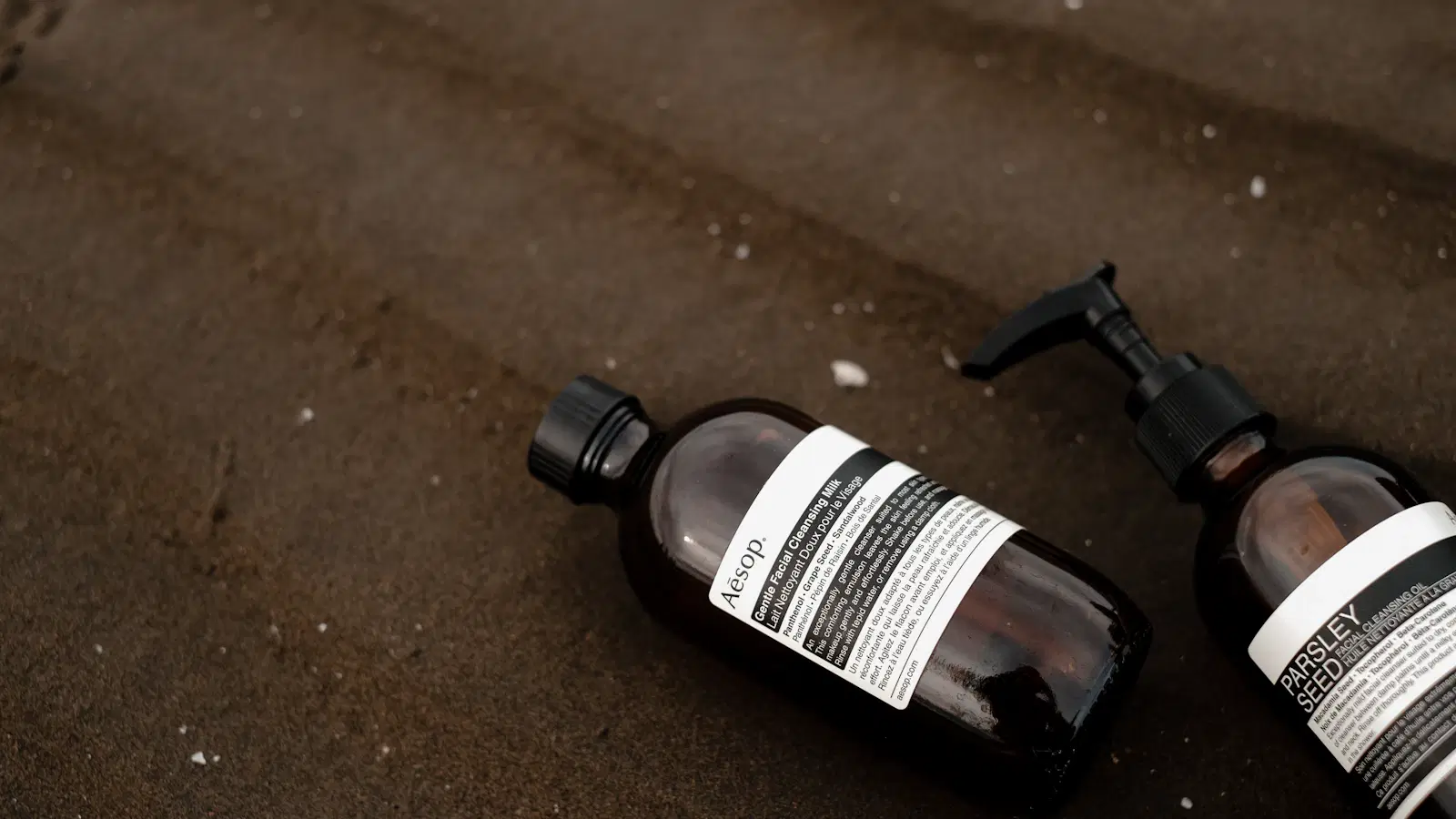 Nair For Men body cream tube on a bathroom shelf next to a timer and a cotton pad — tested 2026 review for coarse male body hair removal