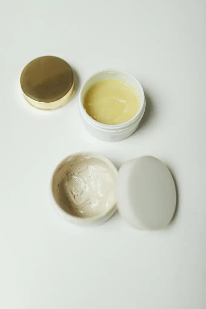 A set of skincare cream containers for a morning and evening post-shave routine