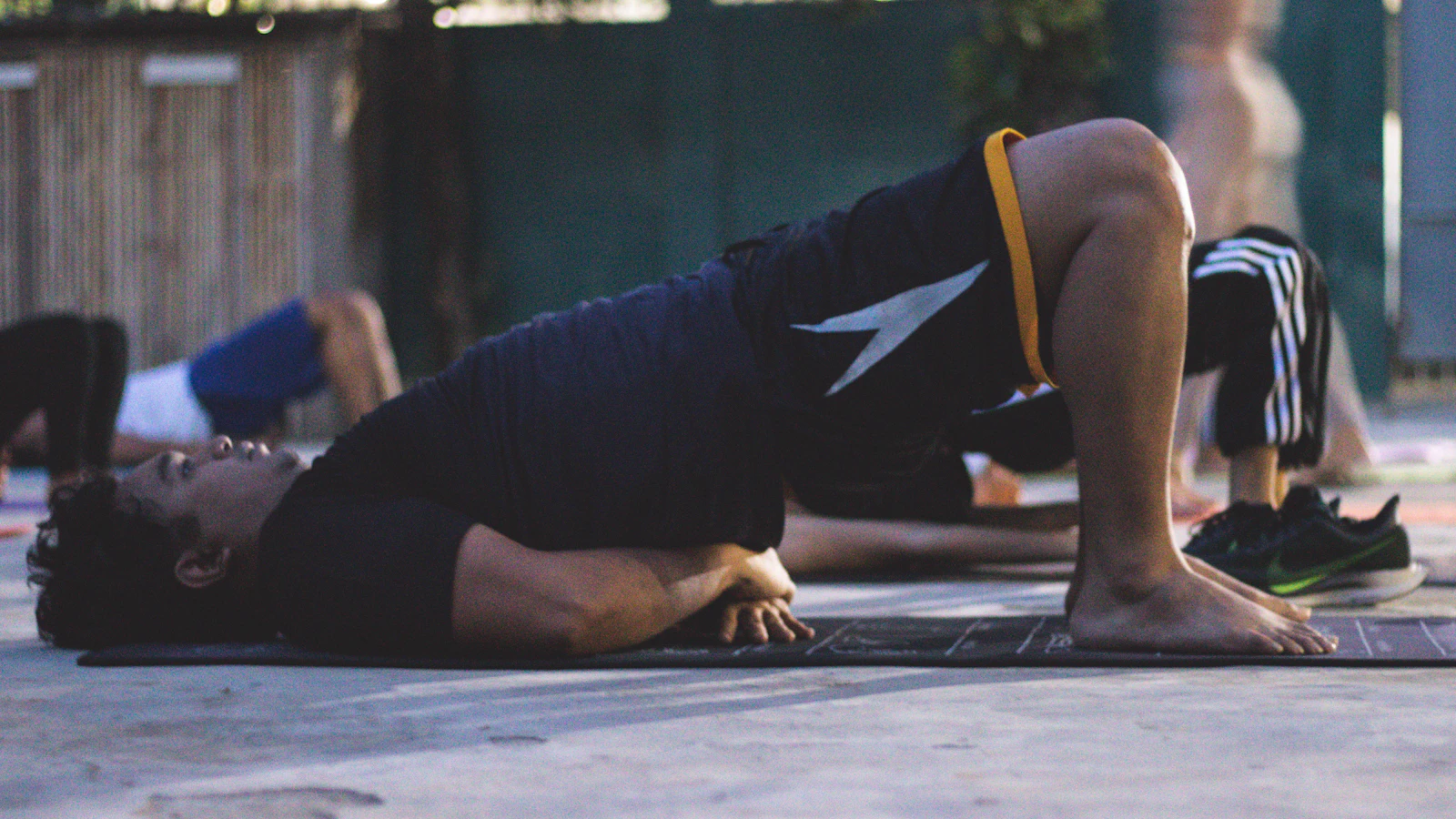 Animated demo of a goblet squat — kettlebell at chest, hips sit below parallel, drive up through the heels to engage the glutes